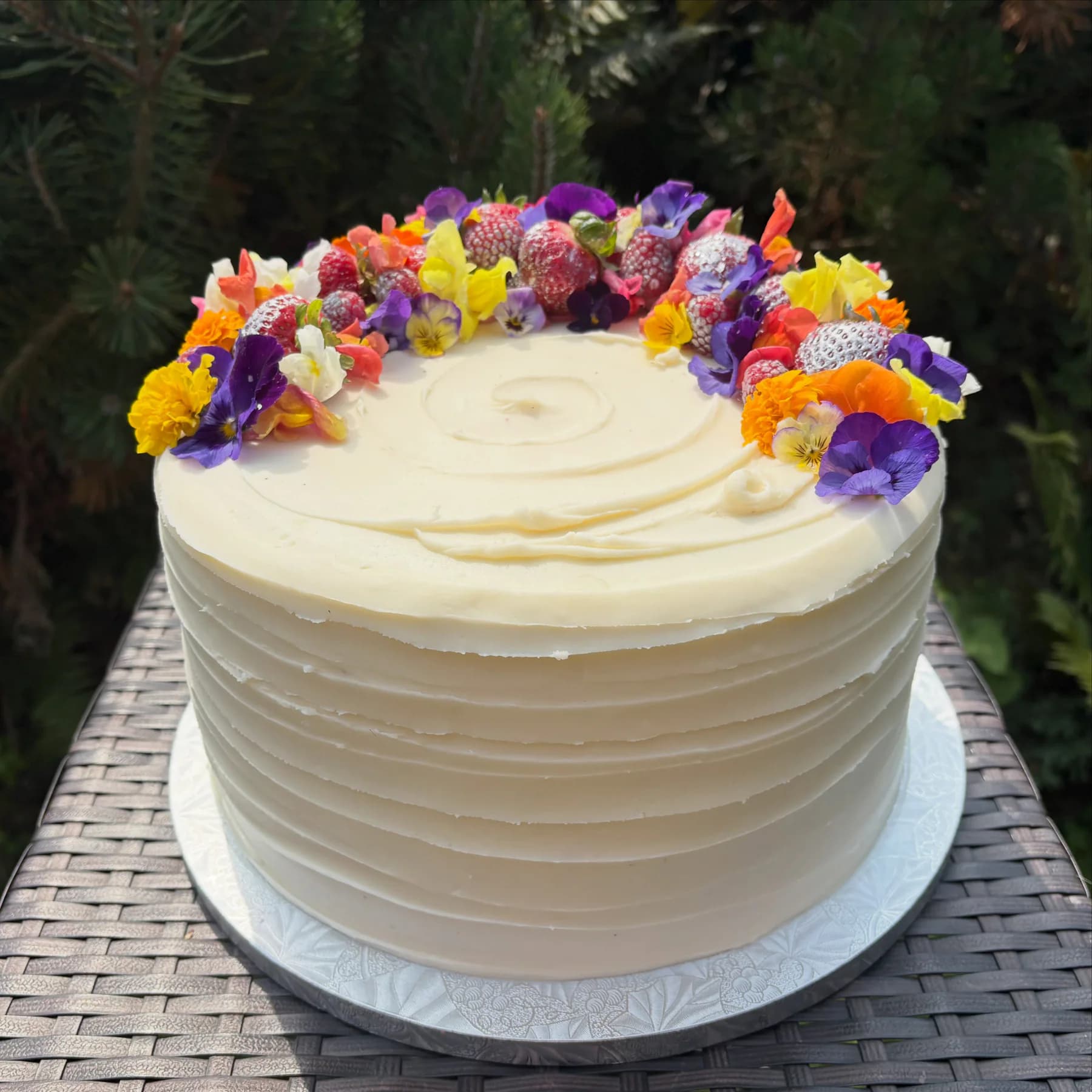 Pastel celebration cake decorated by hand